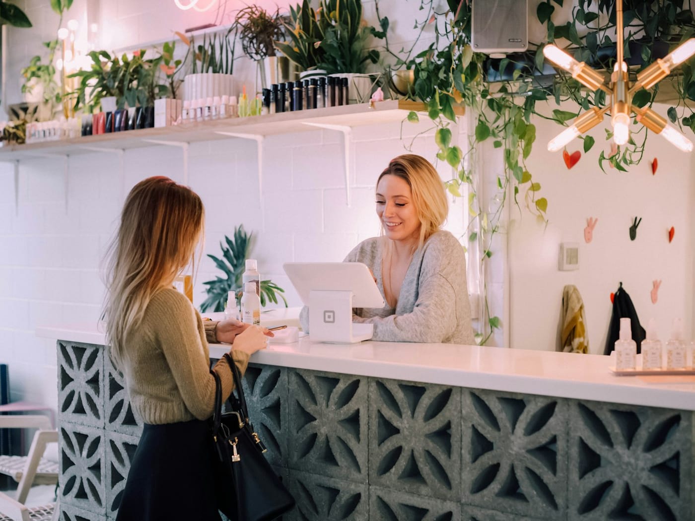 What Counts as Hours Worked? (FLSA Compensable Time) — Front-desk receptionist at the counter where employees punch in and out